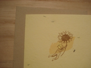 Grow-A-Note Flying baby holding a Huge Sunflower Card (Note: This Card Grows Sunflowers)