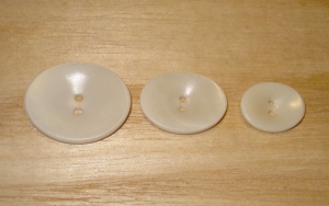 1 1/8" x 7/8" Natural Corozo (Tagua Nut) Oval Saucer Button